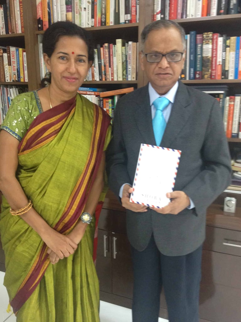 Murthy with book
