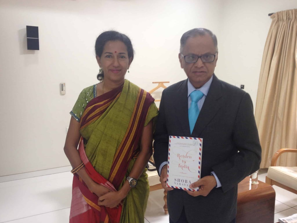 Murthy with book white background