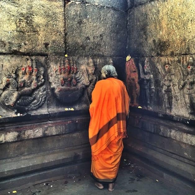 Lady communing with the divine at Someshwara temple in Ulsoor, Bangalore